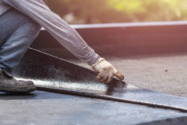 Professional Waterproofing technician working in Portland, MI